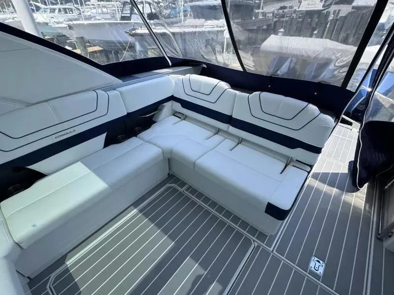 Slide: The Image of 2020 Formula 430 Super Sport Crossover interior with white seating and sleek design. - 7