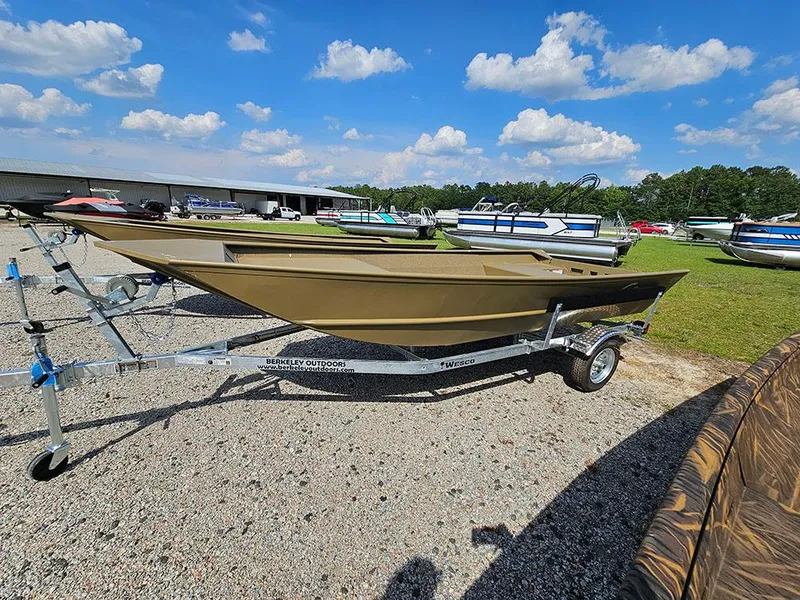 Slide: The Image of 2025 G3 Gator Tough 1548 VBW boat on trailer, parked outdoors under blue sky. - 12