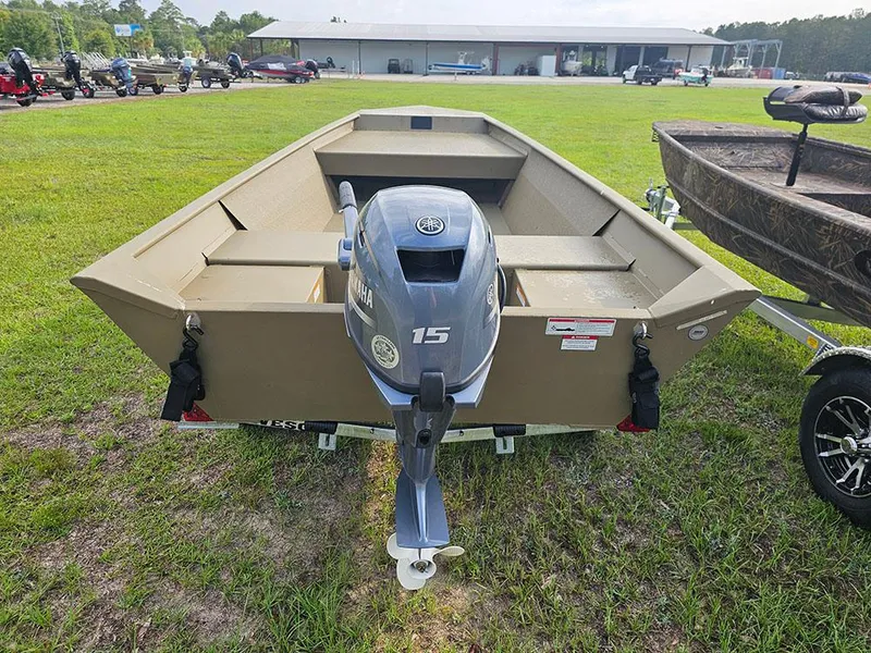 Slide: The Image of 2025 G3 Gator Tough 1548 VBW boat with Yamaha 15HP engine on grassy field. - 6