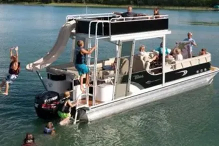 Slide: The Image of 2011 Tahoe Pontoon 2685FS Sierra Funship with slide, people enjoying water activities. - 10