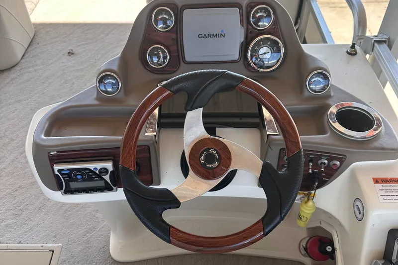 Slide: The Image of Steering console of 2011 Tahoe Pontoon 2685FS Sierra Funship with Garmin navigation system. - 6