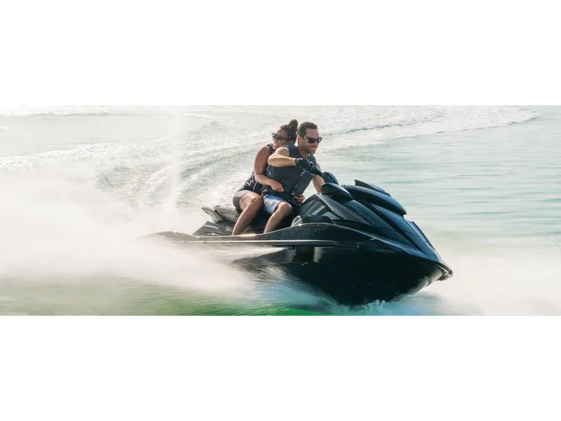 Slide: The Image of 2024 Yamaha GP SVHO jet ski speeding on water with two riders. - 17