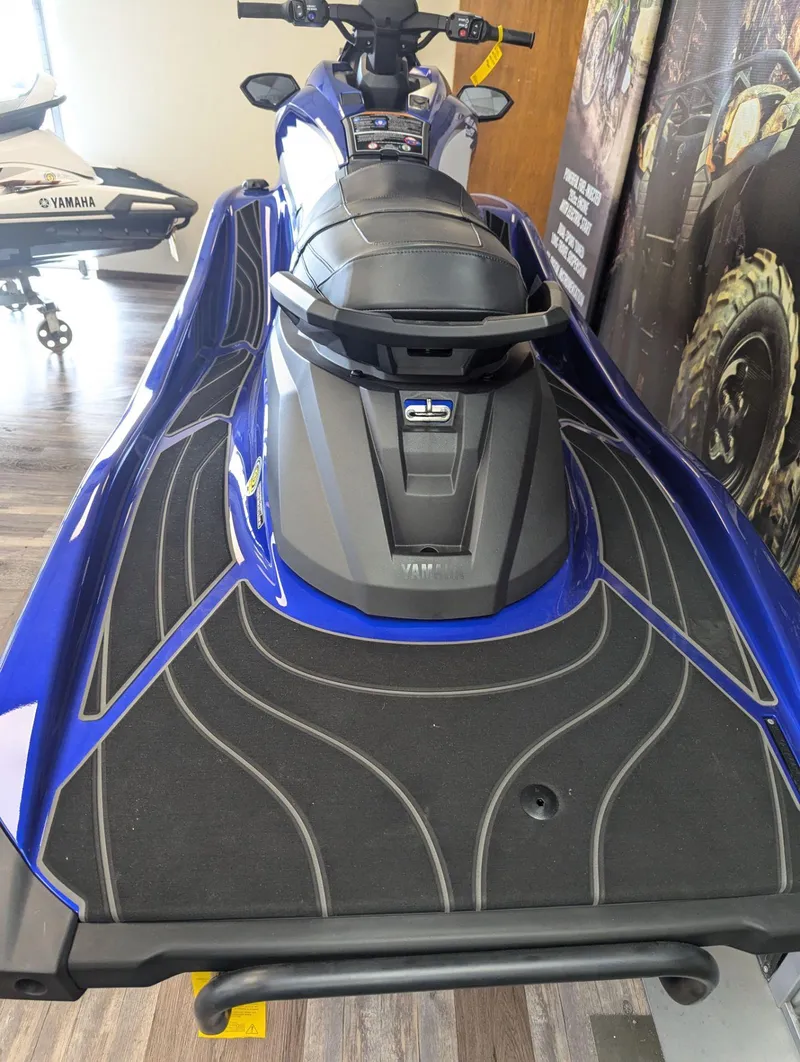 Slide: The Image of 2024 Yamaha Boats GP SVHO jet ski, blue and black design, displayed indoors. - 5