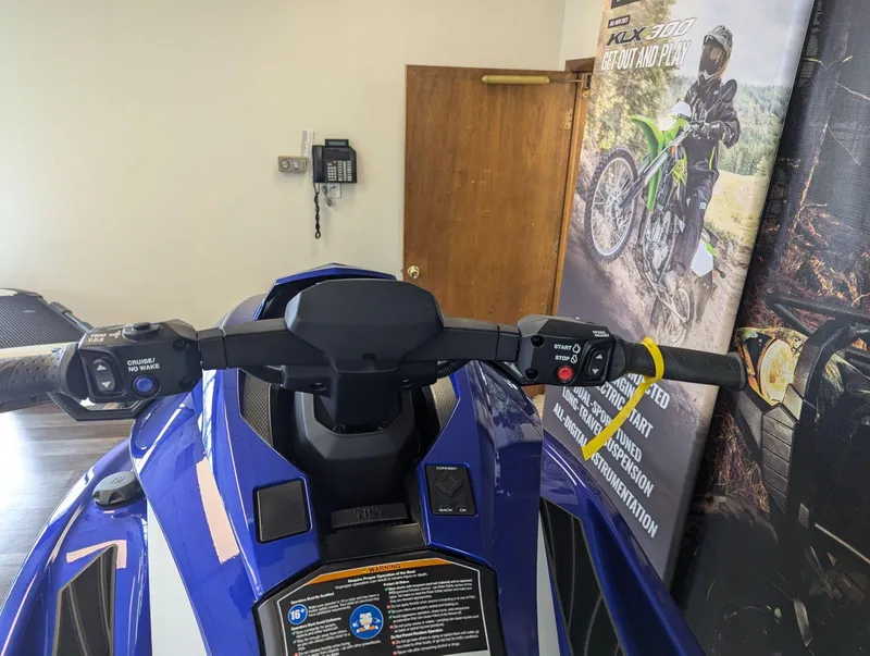 Slide: The Image of 2024 Yamaha Boats GP SVHO jet ski handlebars in showroom setting. - 8
