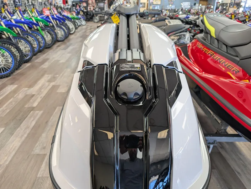 Slide: The Image of 2025 Yamaha Boats SUPERJET in showroom, surrounded by motorcycles and watercraft. - 10