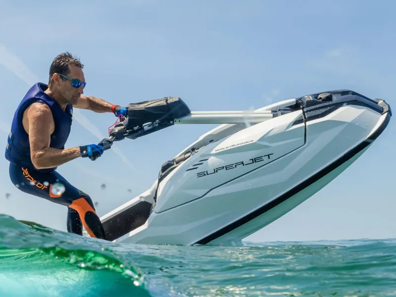 Slide: The Image of Man riding 2025 Yamaha Boats SUPERJET on ocean waves. - 22