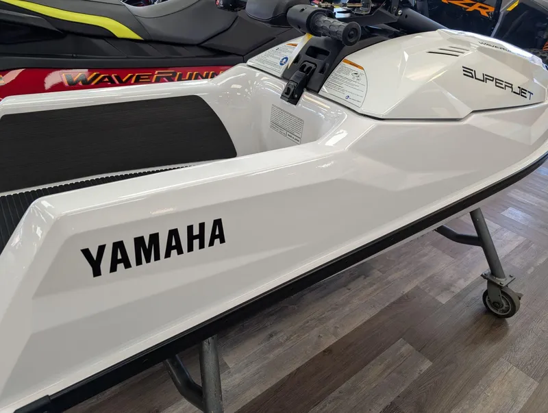 Slide: The Image of 2025 Yamaha SUPERJET jet ski on display, featuring sleek white design and branding. - 4