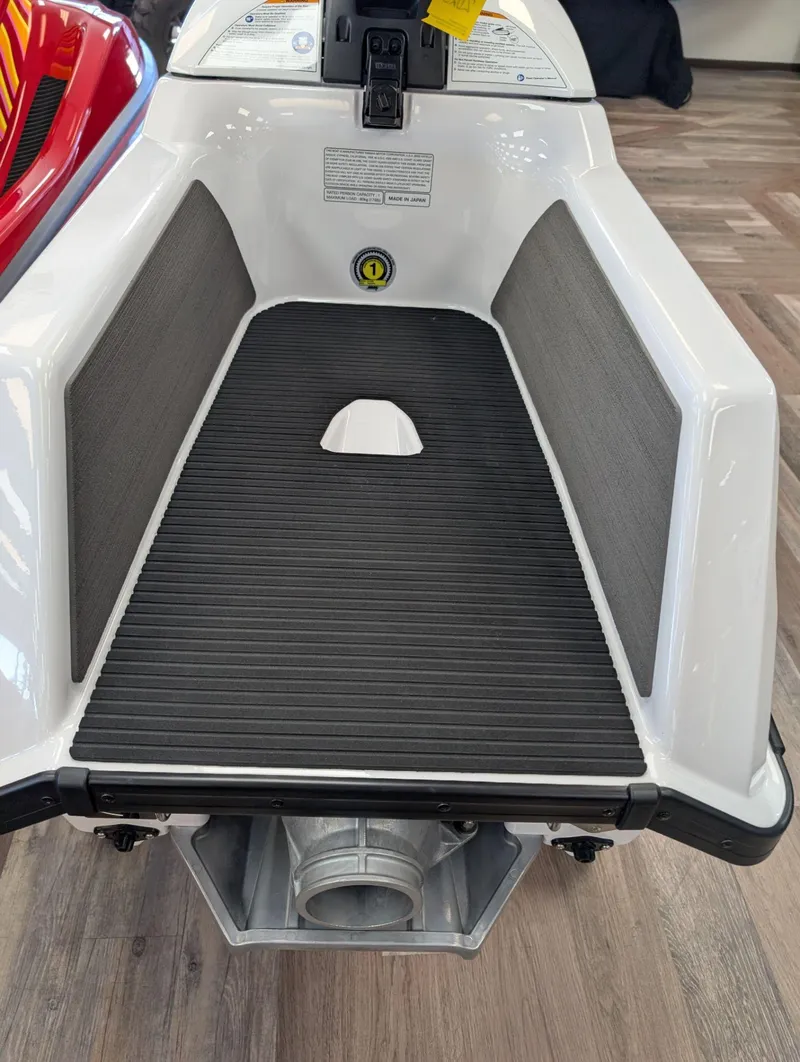 Slide: The Image of 2025 Yamaha Boats SUPERJET interior view with black mat and white hull. - 5