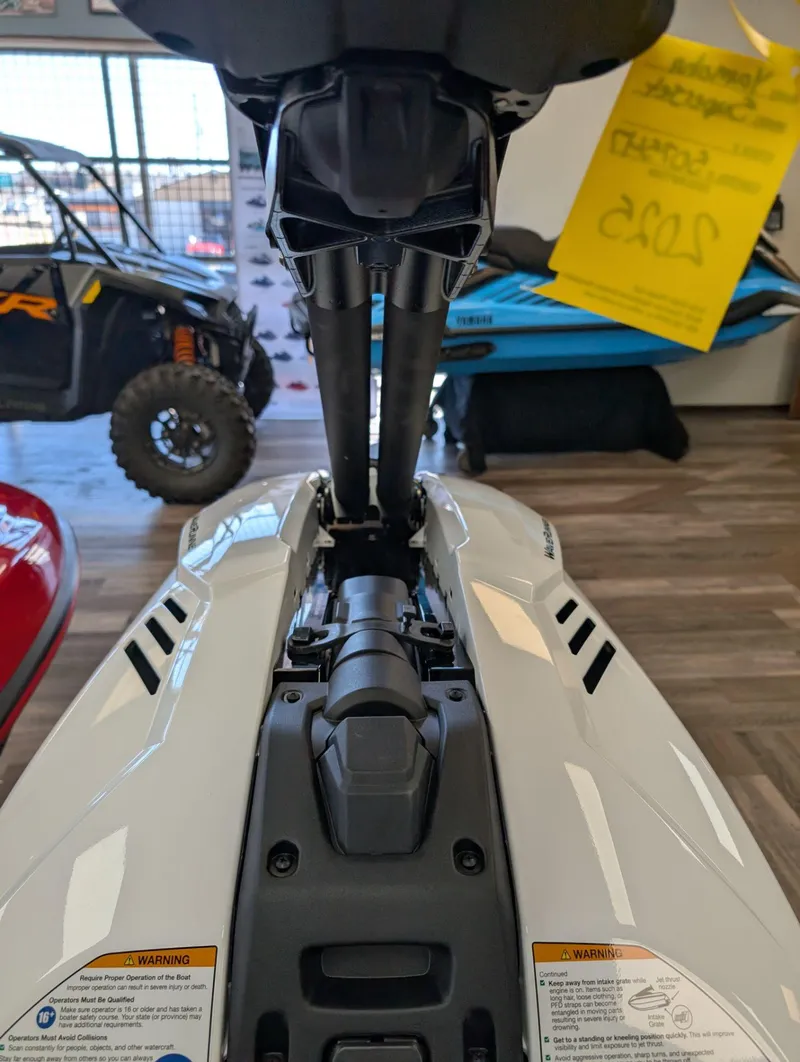 Slide: The Image of 2025 Yamaha Boats SUPERJET in showroom, detailed view of handle and controls. - 8