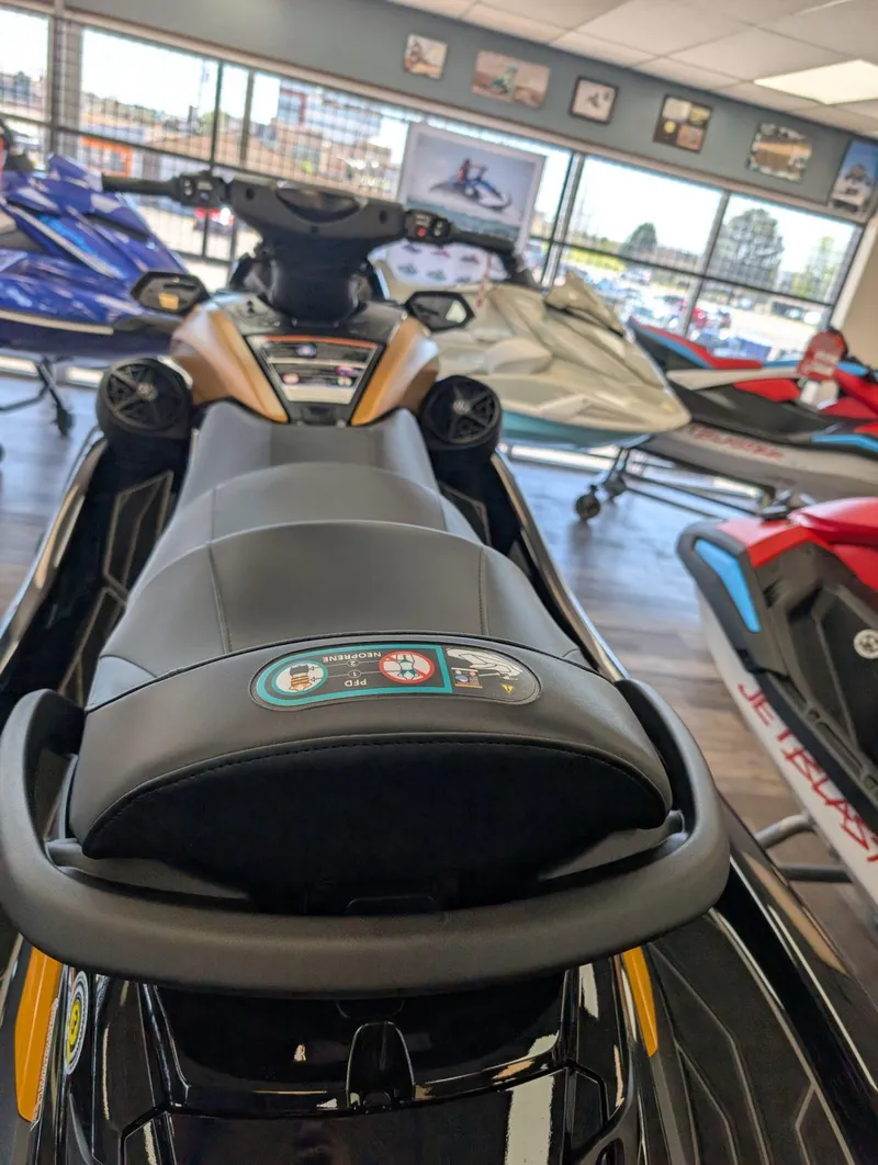 Slide: The Image of 2025 Yamaha FX Cruiser HO with Audio, displayed in a showroom with other jet skis. - 10