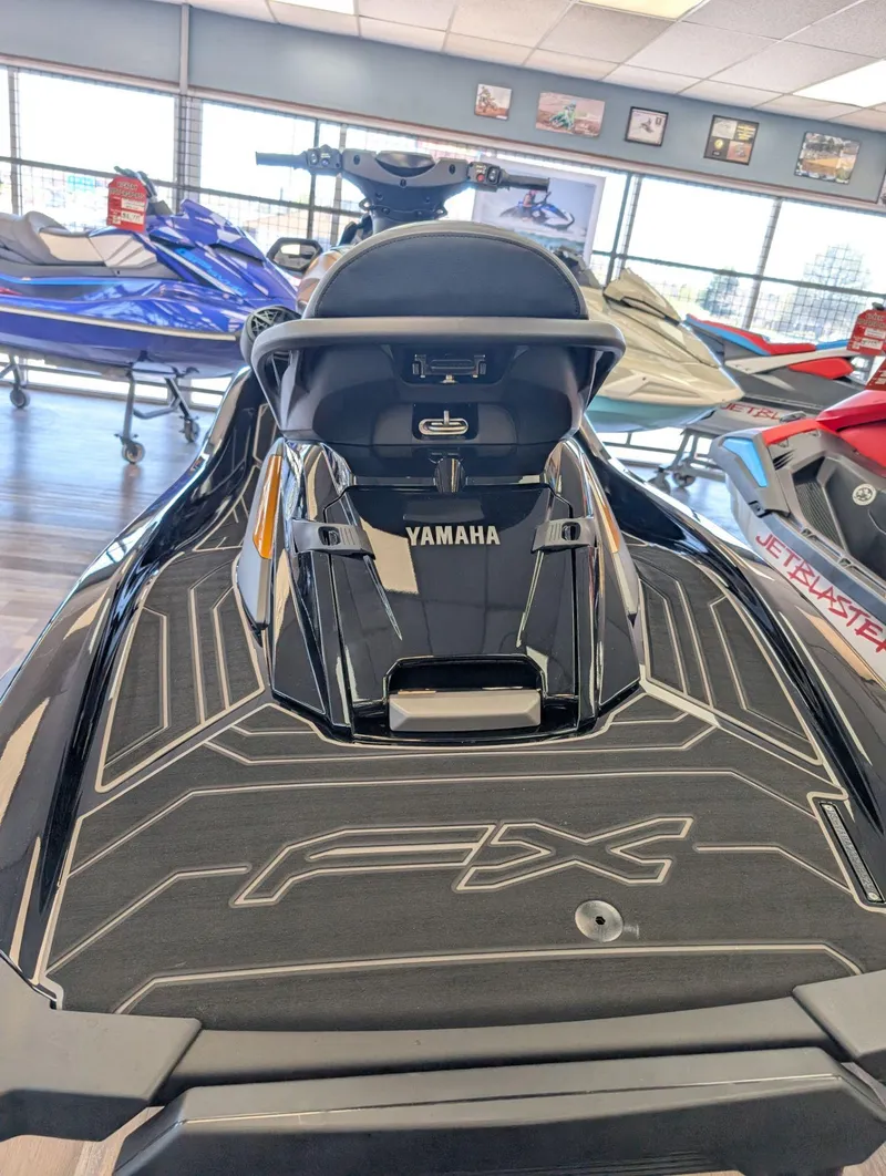 Slide: The Image of 2025 Yamaha FX Cruiser HO with Audio, sleek design, displayed in showroom. - 16