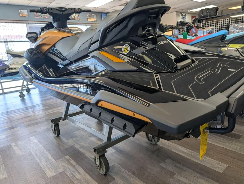 Slide: The Image of 2025 Yamaha FX Cruiser HO with Audio, sleek design, displayed indoors on a stand. - 17