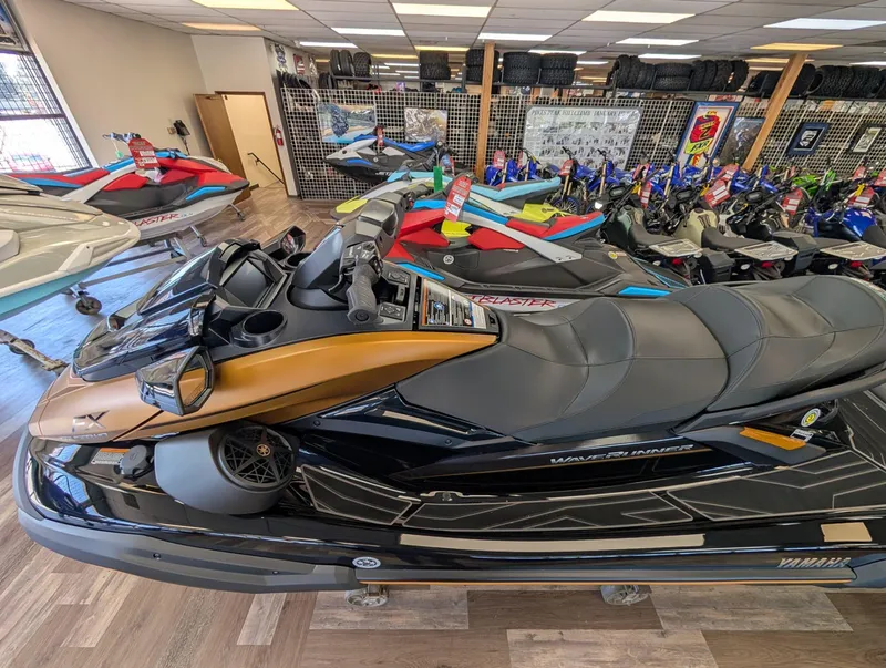 Slide: The Image of 2025 Yamaha FX Cruiser HO with Audio, displayed in a showroom with other watercraft. - 19