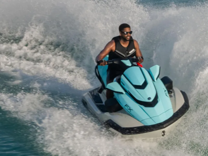 Slide: The Image of 2025 Yamaha FX Cruiser HO with Audio jet ski on water, rider enjoying waves. - 27