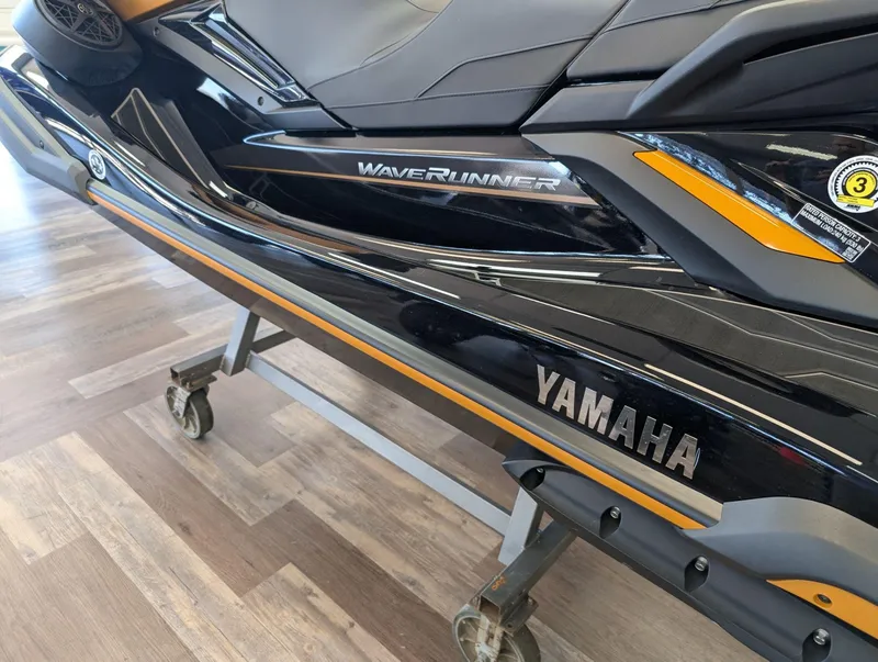 Slide: The Image of 2025 Yamaha FX Cruiser HO with Audio, sleek design on display indoors. - 4