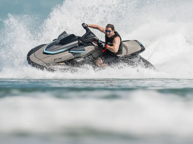 Slide: The Image of 2025 Yamaha FX HO with Audio jet ski riding through waves, showcasing power and agility. - 10