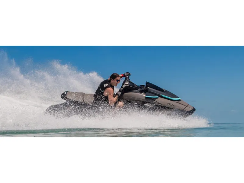 Slide: The Image of 2025 Yamaha FX HO with Audio jet ski speeding on water under clear blue sky. - 8