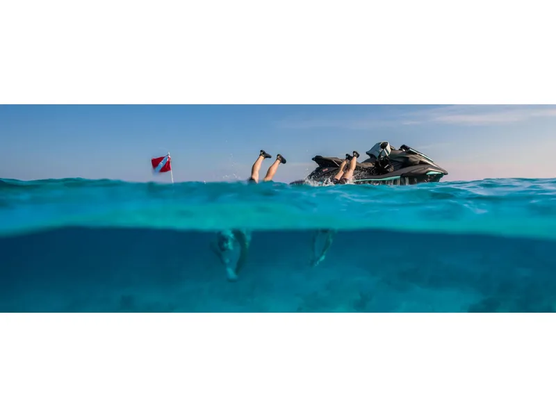 Slide: The Image of 2025 Yamaha FX HO with Audio on clear blue water, diver's legs visible, red flag nearby. - 9