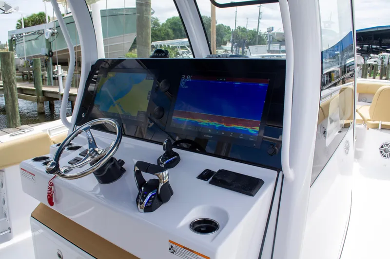 Slide: The Image of 2025 Sportsman Open 352 Center Console dashboard with navigation screens and steering wheel. - 5