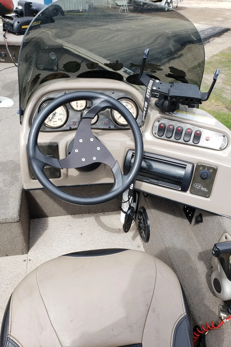Slide: The Image of 2013 G3 V172C boat dashboard with steering wheel and control panel. - 5