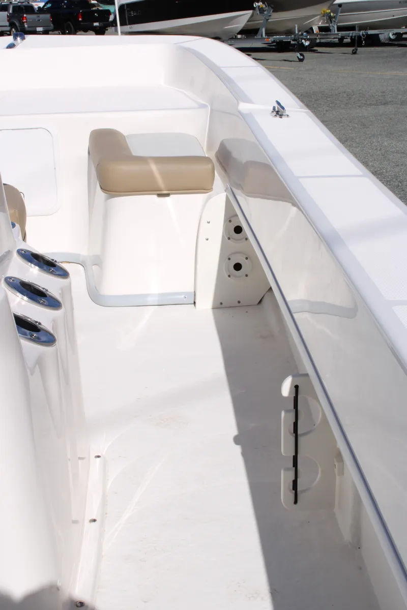 Slide: The Image of 2025 Sundance B20CCR boat interior with seating and storage compartments. - 16