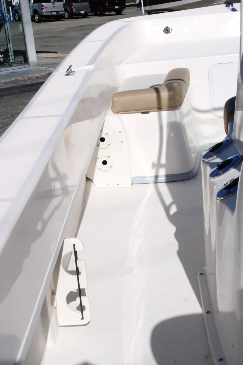 Slide: The Image of 2025 Sundance B20CCR boat interior with beige seating and white deck. - 17