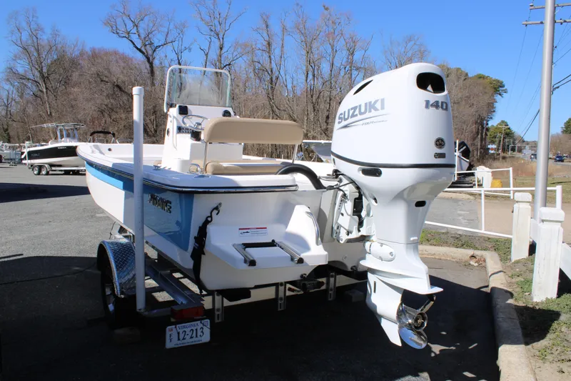 Slide: The Image of 2025 Sundance B20CCR boat with Suzuki 140 outboard motor on a trailer. - 2