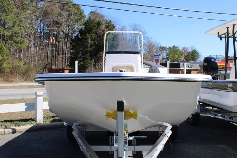 Slide: The Image of 2025 Sundance B20CCR boat on trailer, front view, outdoors, clear sky. - 3