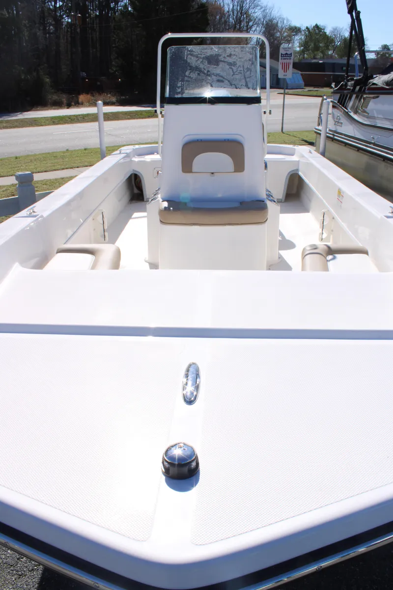 Slide: The Image of 2025 Sundance B20CCR boat with center console and seating, displayed outdoors. - 5