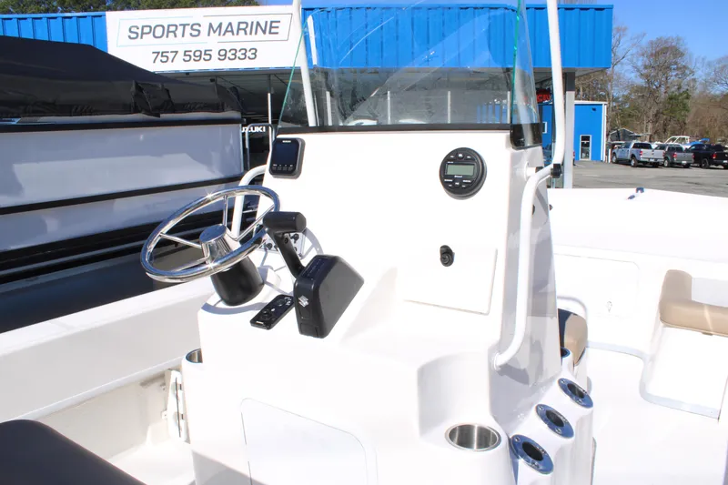 Slide: The Image of 2025 Sundance B20CCR boat console with steering wheel at Sports Marine dealership. - 8