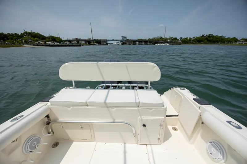 Slide: The Image of 2000 Pursuit 2470 Center Console boat on calm water, view from the deck. - 21