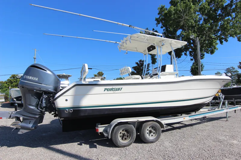 Slide: The Image of 2000 Pursuit 2470 Center Console boat on trailer with Yamaha outboard motor. - 28
