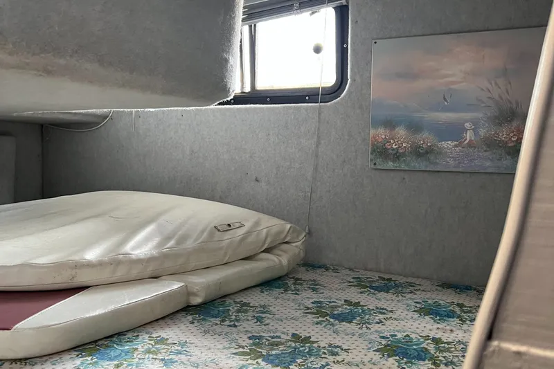 Slide: The Image of Interior of 1988 Silverton 34X Express with floral carpet and wall art. - 16