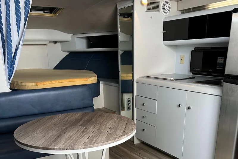 Slide: The Image of Interior of a 1988 Silverton 34X Express boat with kitchenette and sleeping area. - 17