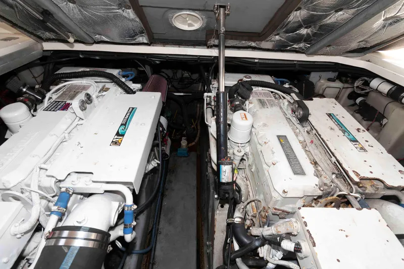 Slide: The Image of Engine room of a 2000 Sea Ray 410 Sundancer boat, showcasing dual engines. - 16