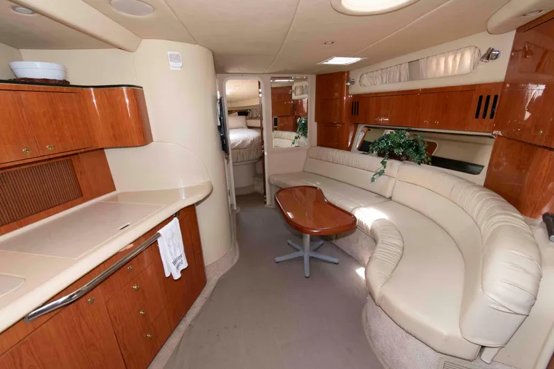 Slide: The Image of Luxurious interior of 2000 Sea Ray 410 Sundancer yacht with elegant seating and cabinetry. - 8