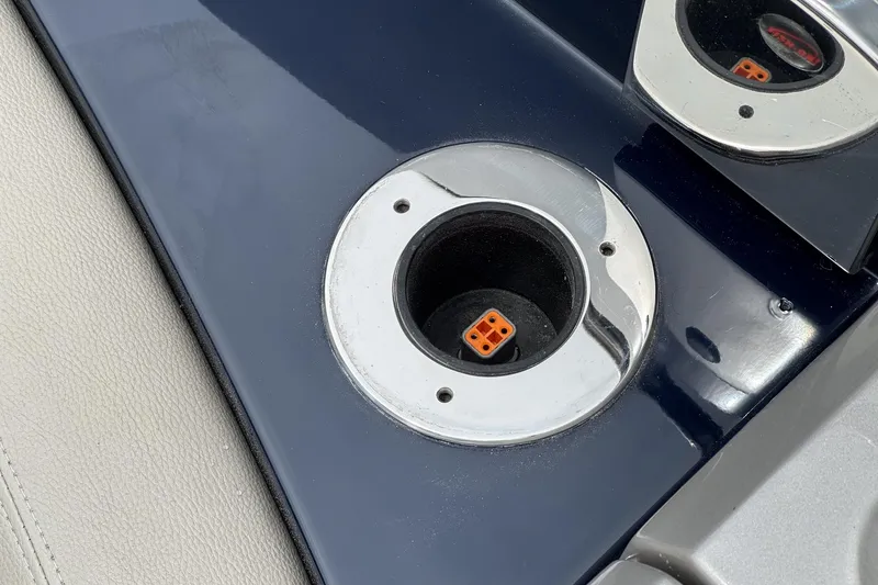 Slide: The Image of Cup holder on a 2006 Riva 44 RivaRama yacht, featuring a sleek chrome finish. - 29