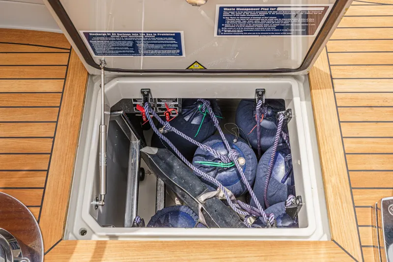 Slide: The Image of Storage compartment on a 2006 Riva 44 RivaRama yacht, containing ropes and equipment. - 43