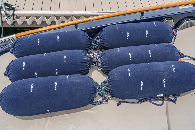 Slide: The Image of Blue fenders on a Riva 44 RivaRama yacht, 2006 model, docked. - 44