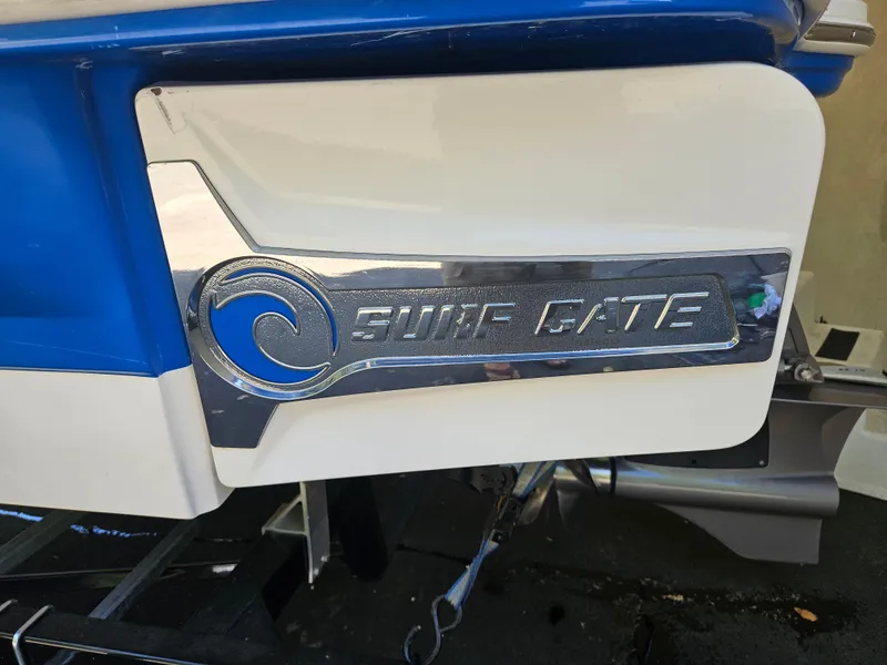 Slide: The Image of 2018 Chaparral 21 H2O Surf boat with "Surf Gate" feature, close-up view. - 7