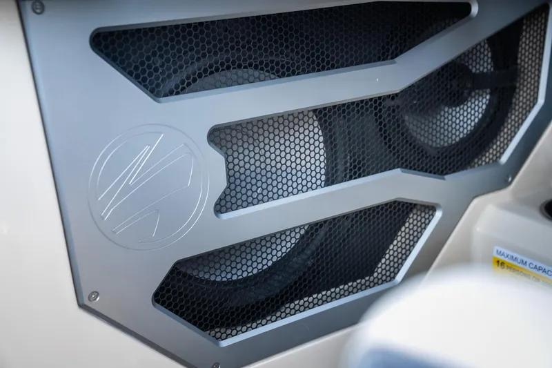 Slide: The Image of Speaker system in 2025 Tigé Ultré 23ZX boat, featuring sleek metal grille design. - 10