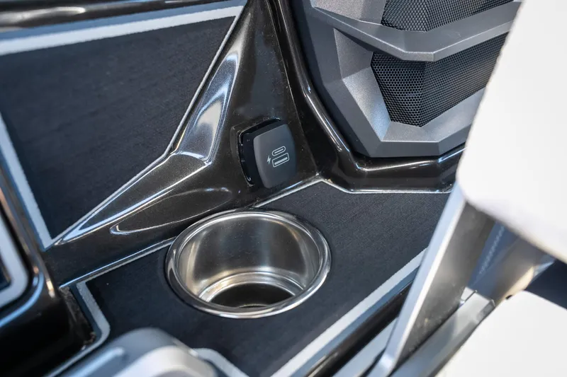 Slide: The Image of Cup holder and USB port in 2025 Tigé Ultré 23ZX boat interior. - 12