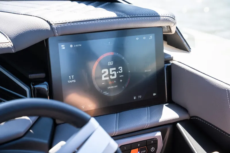 Slide: The Image of 2025 Tigé Ultré 23ZX dashboard with digital display showing speed and controls. - 16
