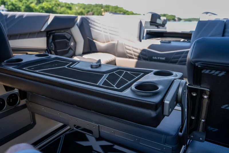Slide: The Image of 2025 Tigé Ultré 23ZX boat interior with cup holders and sleek seating design. - 17