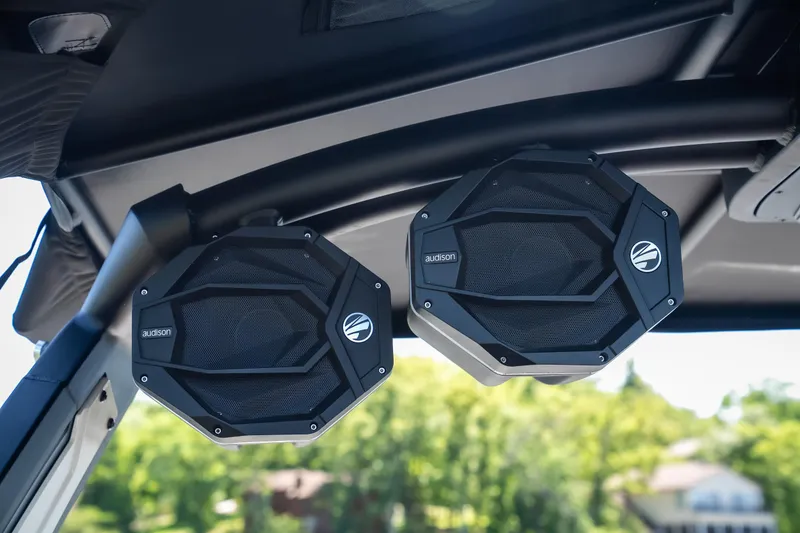 Slide: The Image of 2025 Tigé Ultré 23ZX boat speakers, mounted on a sleek black frame, outdoors. - 18
