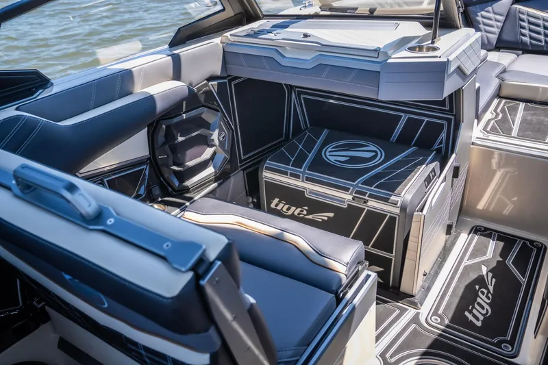 Slide: The Image of 2025 Tigé Ultré 23ZX boat interior with modern seating and sleek design. - 19