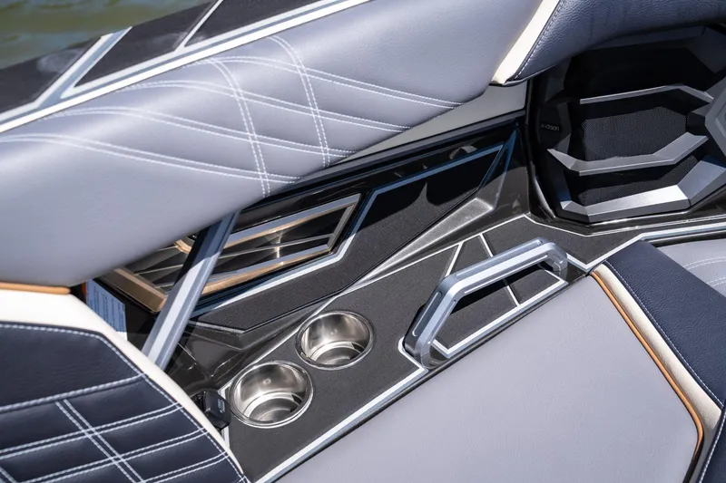 Slide: The Image of 2025 Tigé Ultré 23ZX interior with sleek design, cup holders, and modern upholstery. - 21