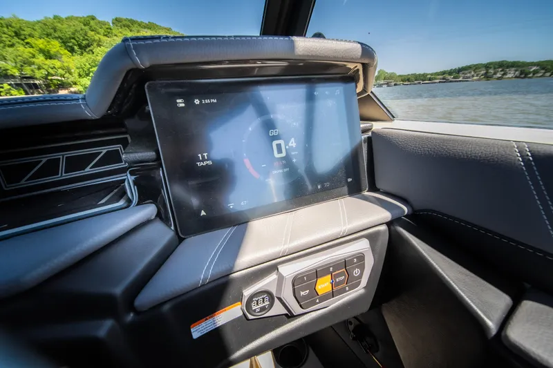 Slide: The Image of 2025 Tigé Ultré 23ZX dashboard with touchscreen display, showcasing modern boat technology. - 28