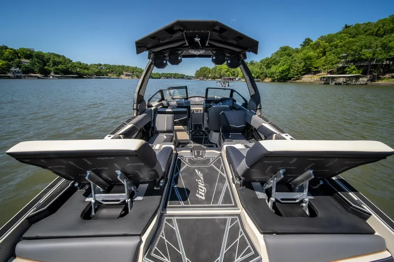Slide: The Image of 2025 Tigé Ultré 23ZX boat interior on a scenic lake. - 34