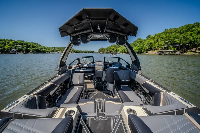 Slide: The Image of 2025 Tigé Ultré 23ZX boat interior on a scenic lake. - 35